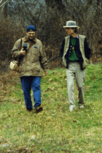 Brandon Kirk and John Hartford at the Laury Hicks grave, Calhoun County, WV, 1996