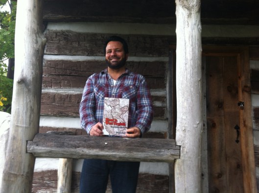 When traveling, I seldom miss an opportunity to introduce my book to a log cabin. Here we are at the Bailey Log Cabin in Bluefield, VA. October 2015